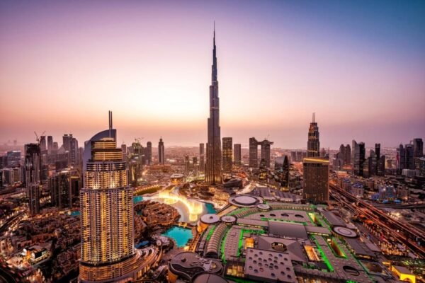 Dubai skyline with the Burj Khalifa glowing at dusk