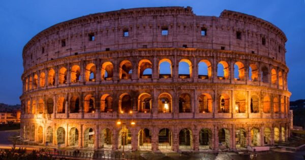 The Colosseum in Rome lit up in the evening