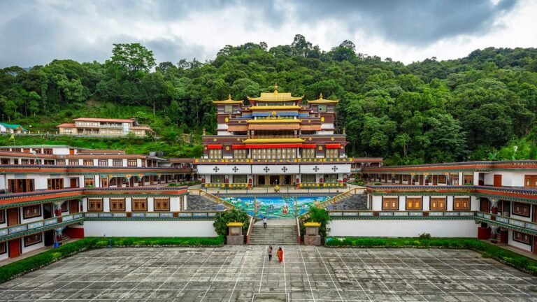 Buddhist monastery surrounded by green forest near Gangtok