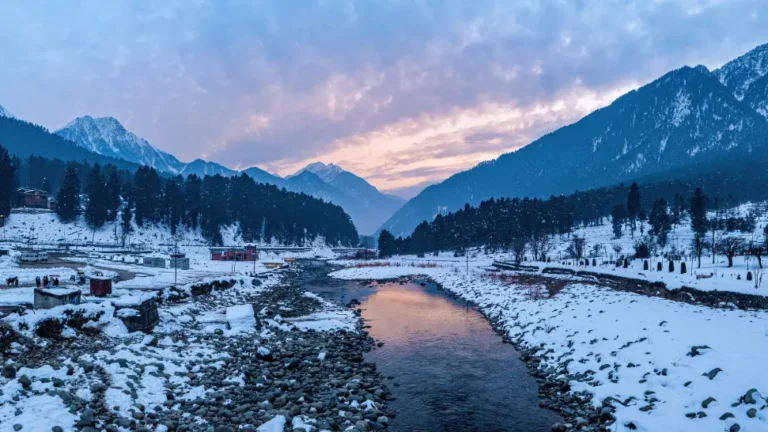 Snowy riverbank in a Himalayan valley near Sonamarg