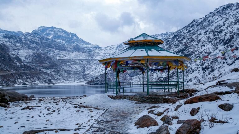 Snow-covered Tsomgo Lake near Gangtok with a viewing gazebo